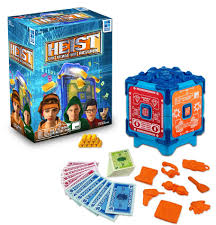 The product packaging of HEIST next to the contents of the merchandise
